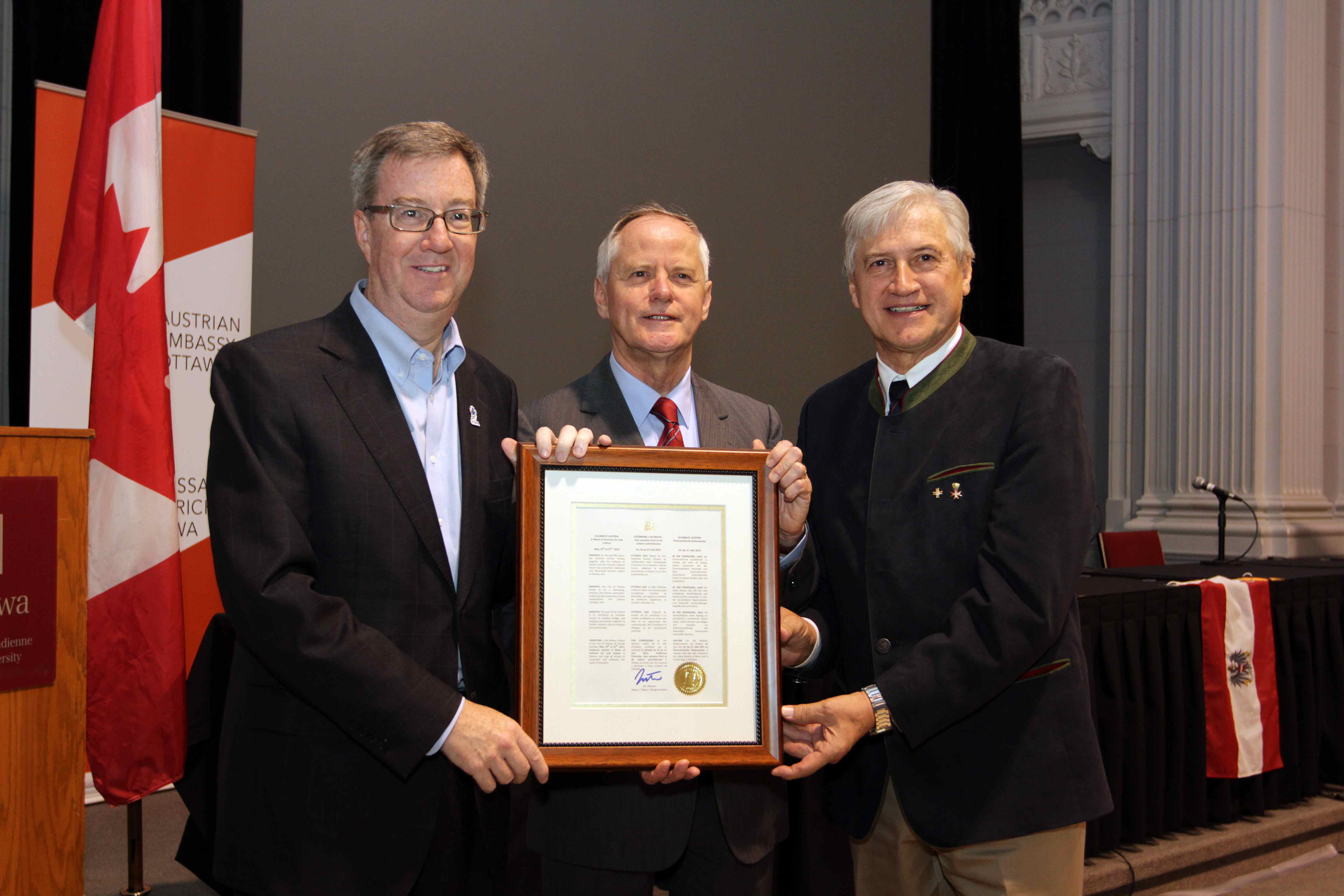 Mayor Watson, Amb. Riedel and ACC Pres. Pirker hold the proclamation Mayor Watson, Amb. Riedel and ACC Pres. Pirker hold the proclamation